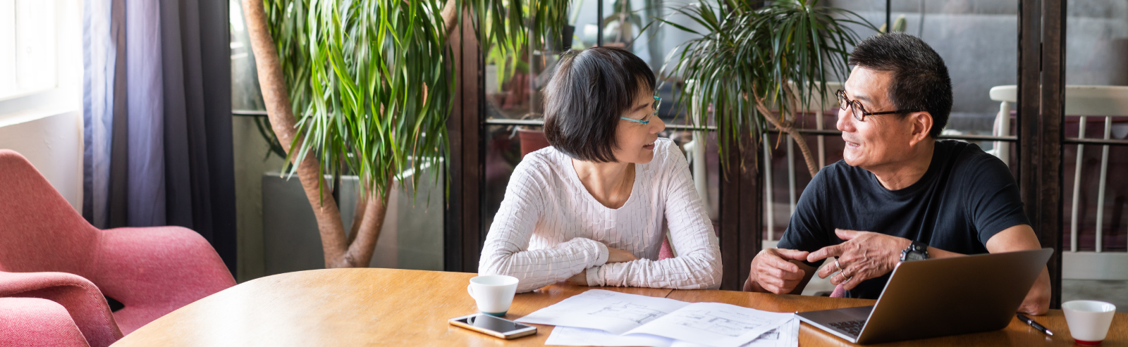 man and woman at table talking